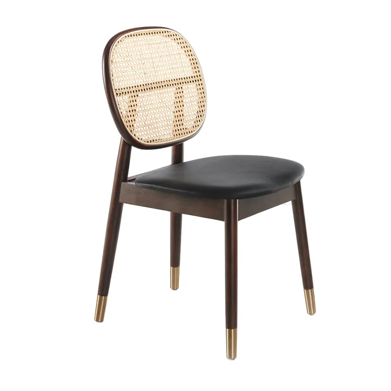 Silla tapizada en polipiel con respaldo en rattan y patas en madera de nogal - Sillas